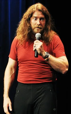 Craig Campbell on stage with a microphone